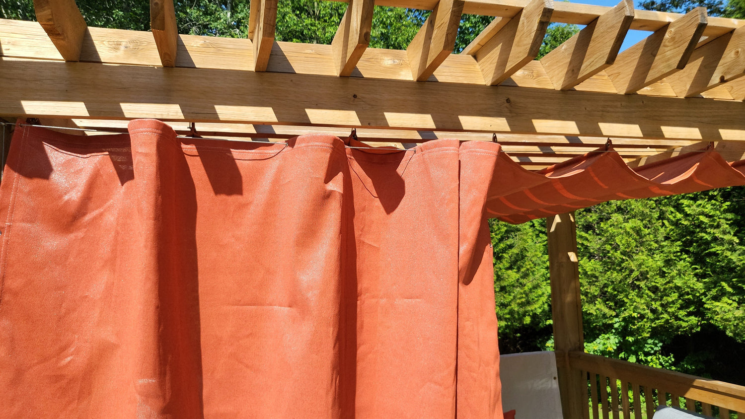 close up image of an orange deck shade sail