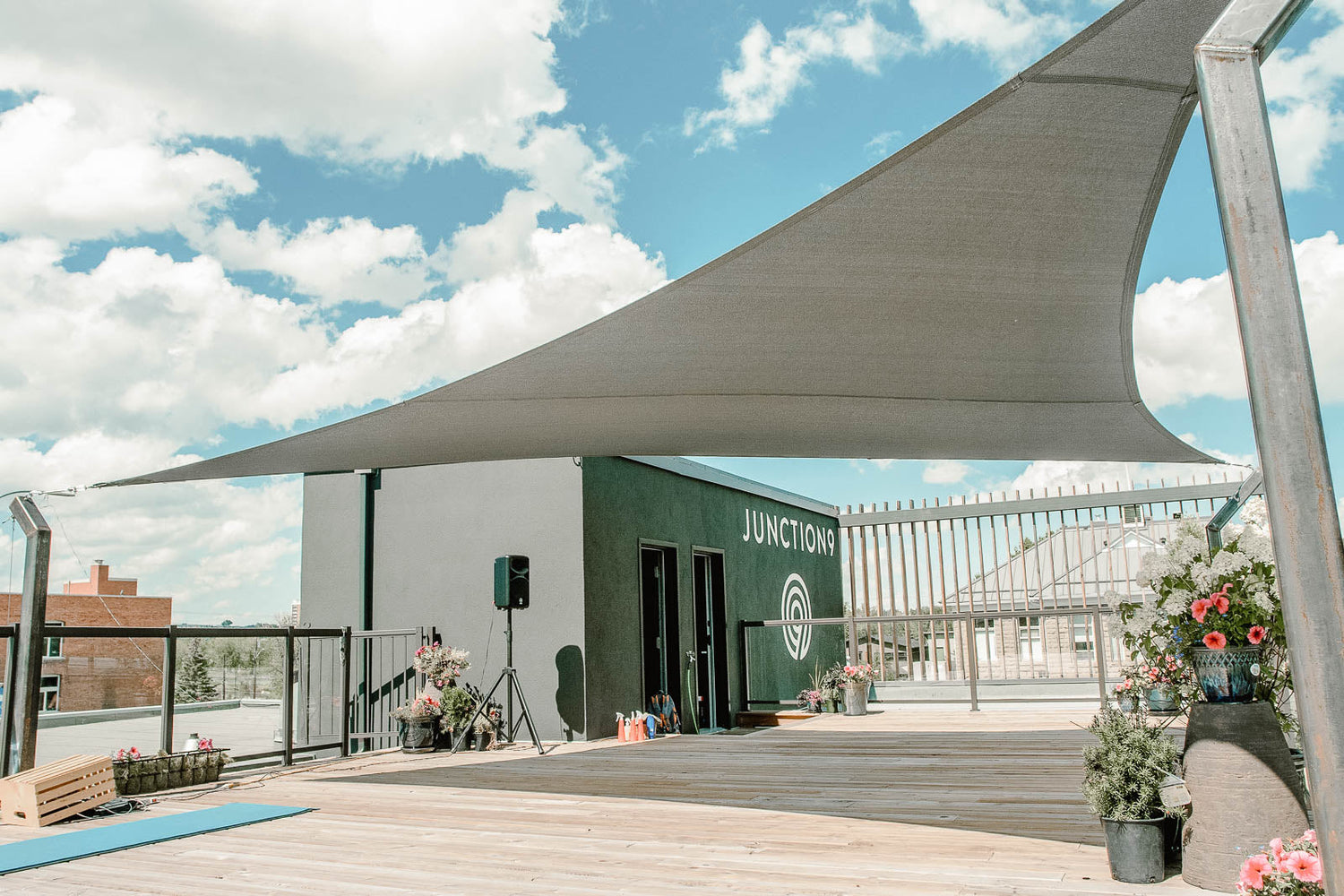 Image of the "Junction" with a shade sail outside of it showcasing modern outdoor design
