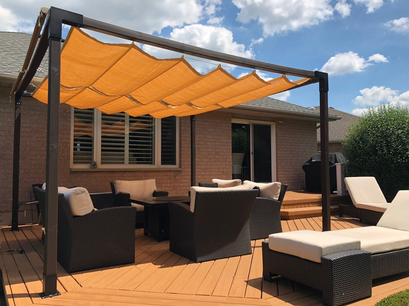 image of an orange pergola shade over a deck showcasing shade sails for decks.