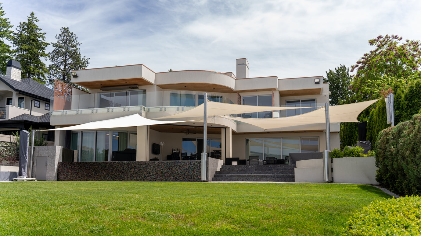 Outdoor Shades for Porch installed on a modern home patio, creating wide sun coverage over the outdoor seating area.