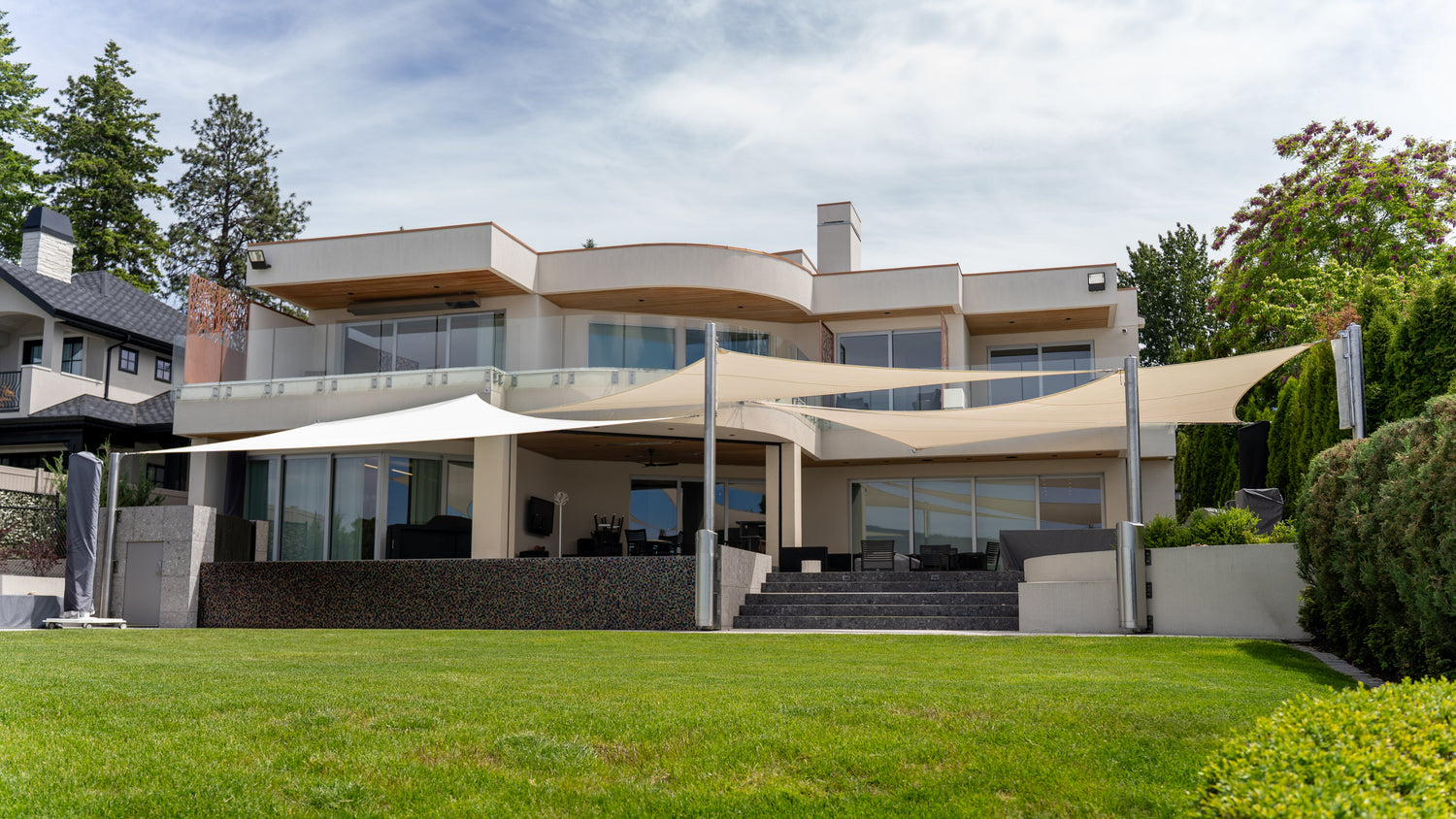 Outdoor Shades for Porch installed on a modern home patio, creating wide sun coverage over the outdoor seating area.