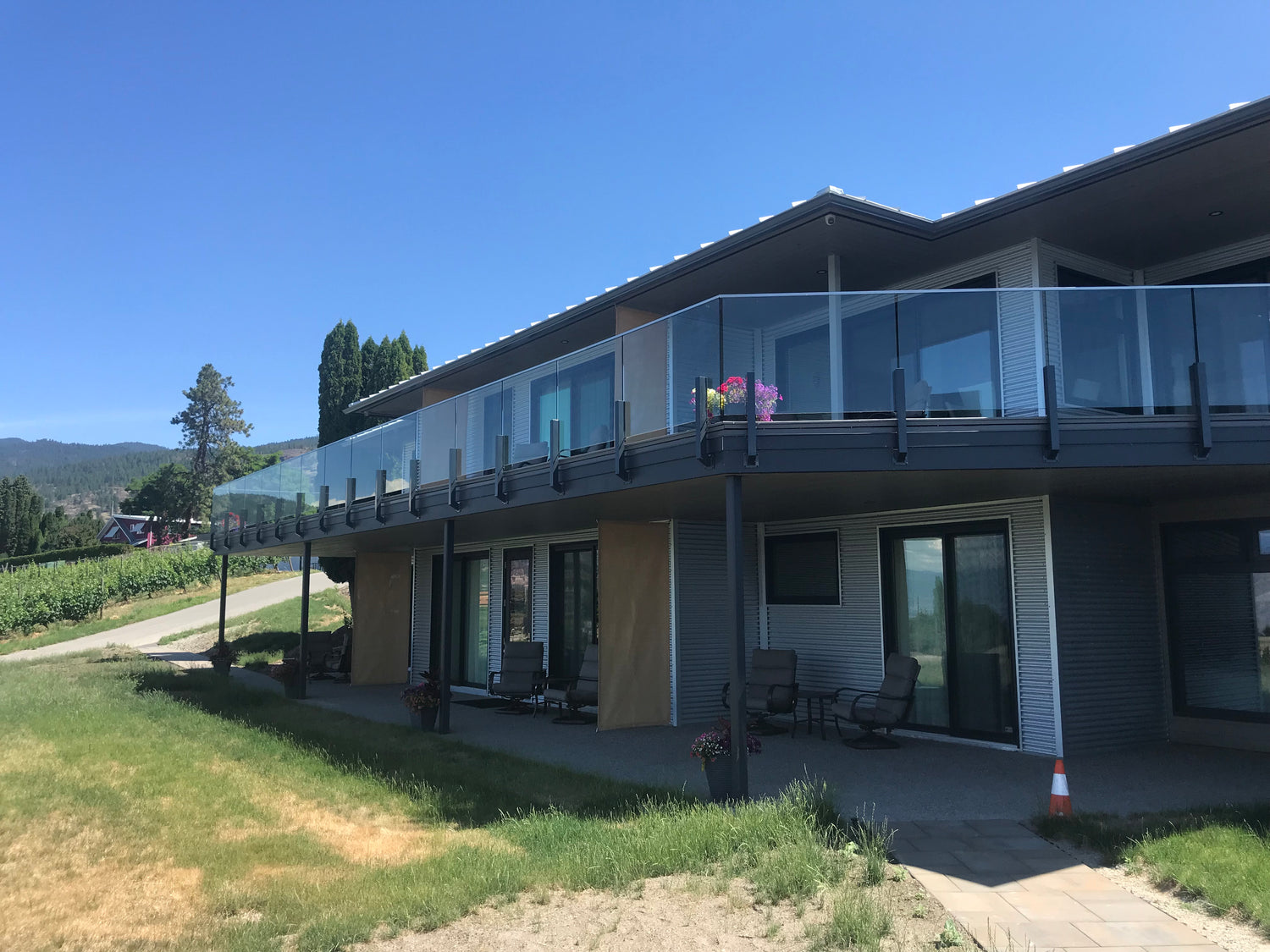 Modern house with a large balcony and a garden in a shaded area, illustrating the need for the best solar lights for shaded areas.