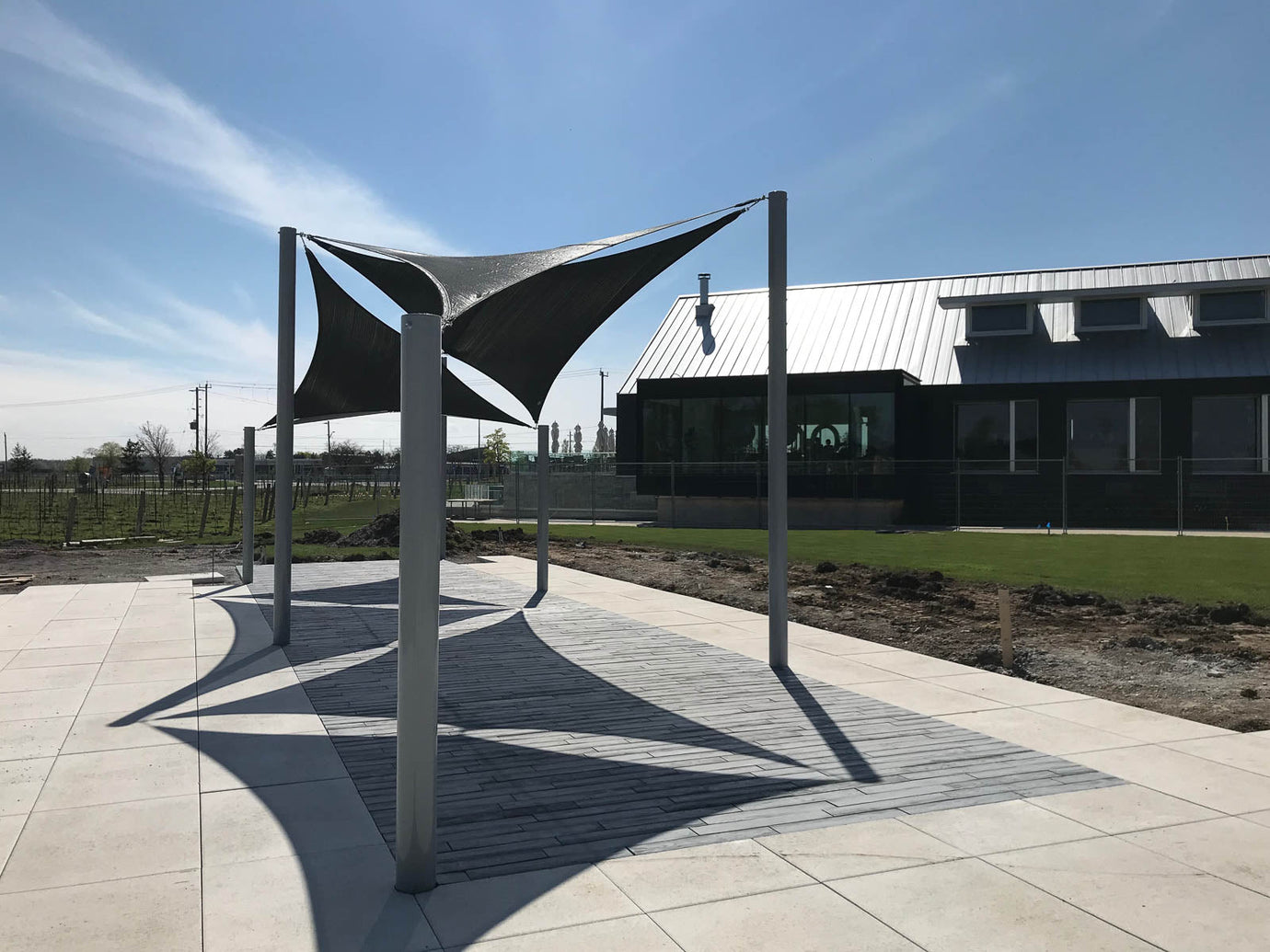 black commercial shade design over a patio.