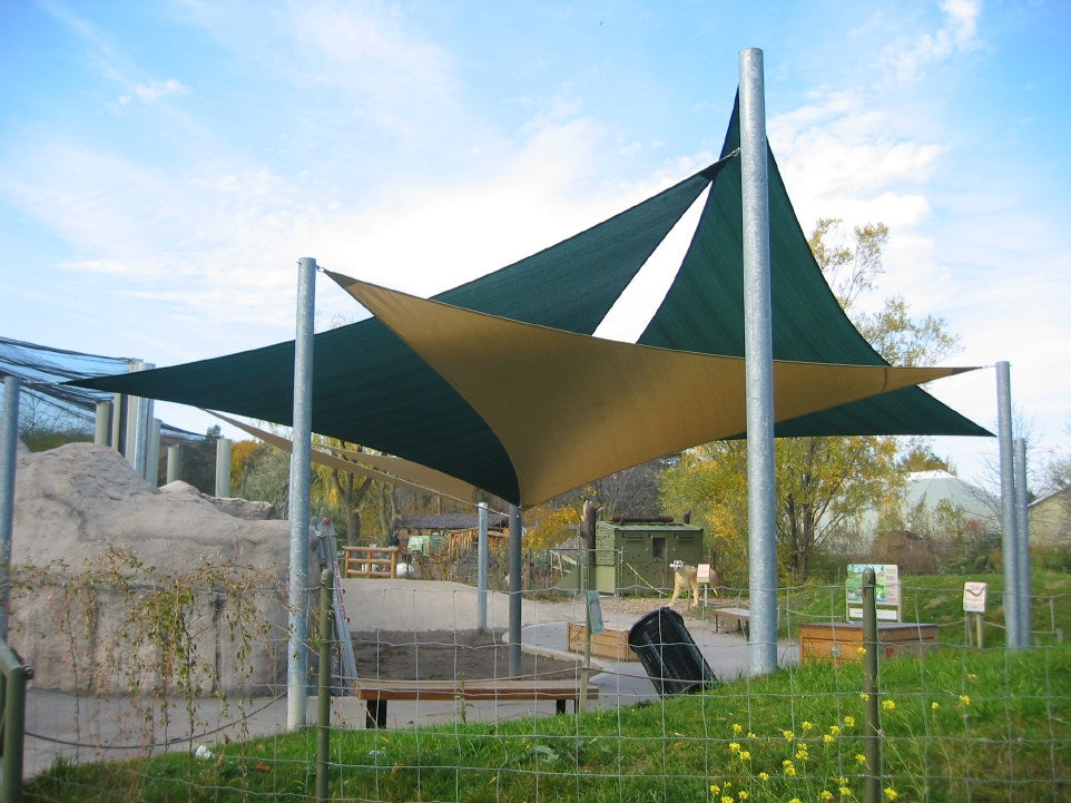 image of three shade sails at the zoo providing shade over a bench and maximizing outdoor productivity