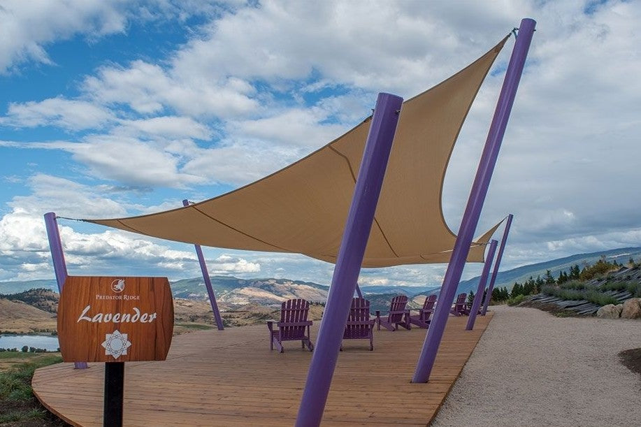 image of beige shade sail with a sustainable design overlooking a breathtaking view.