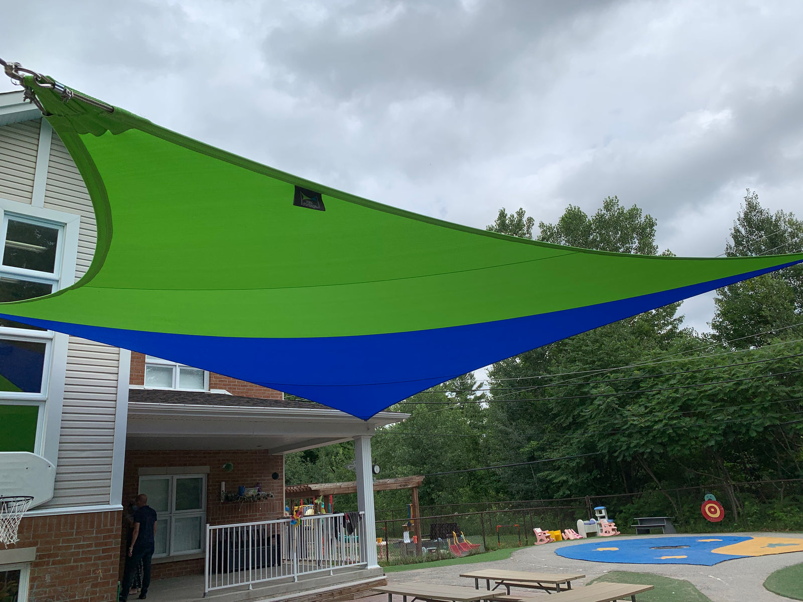 Shade sail installation at Les Croquignoles outdoor playground