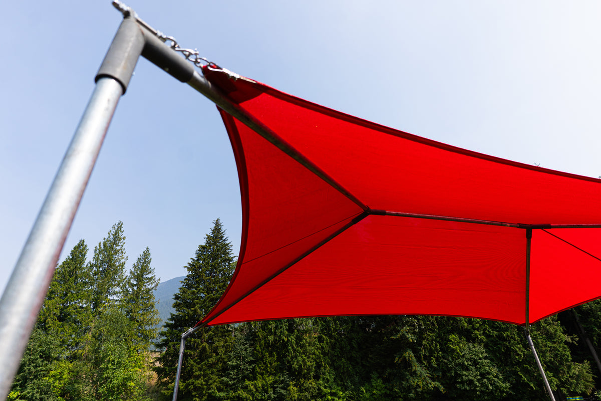A bright red tension fabric canopy